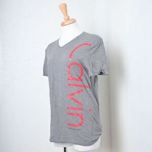 Calvin Klein | Light grey woman's v neck t shirt with red side logo
